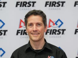 Dave Ellis in front of FIRST Canada logo